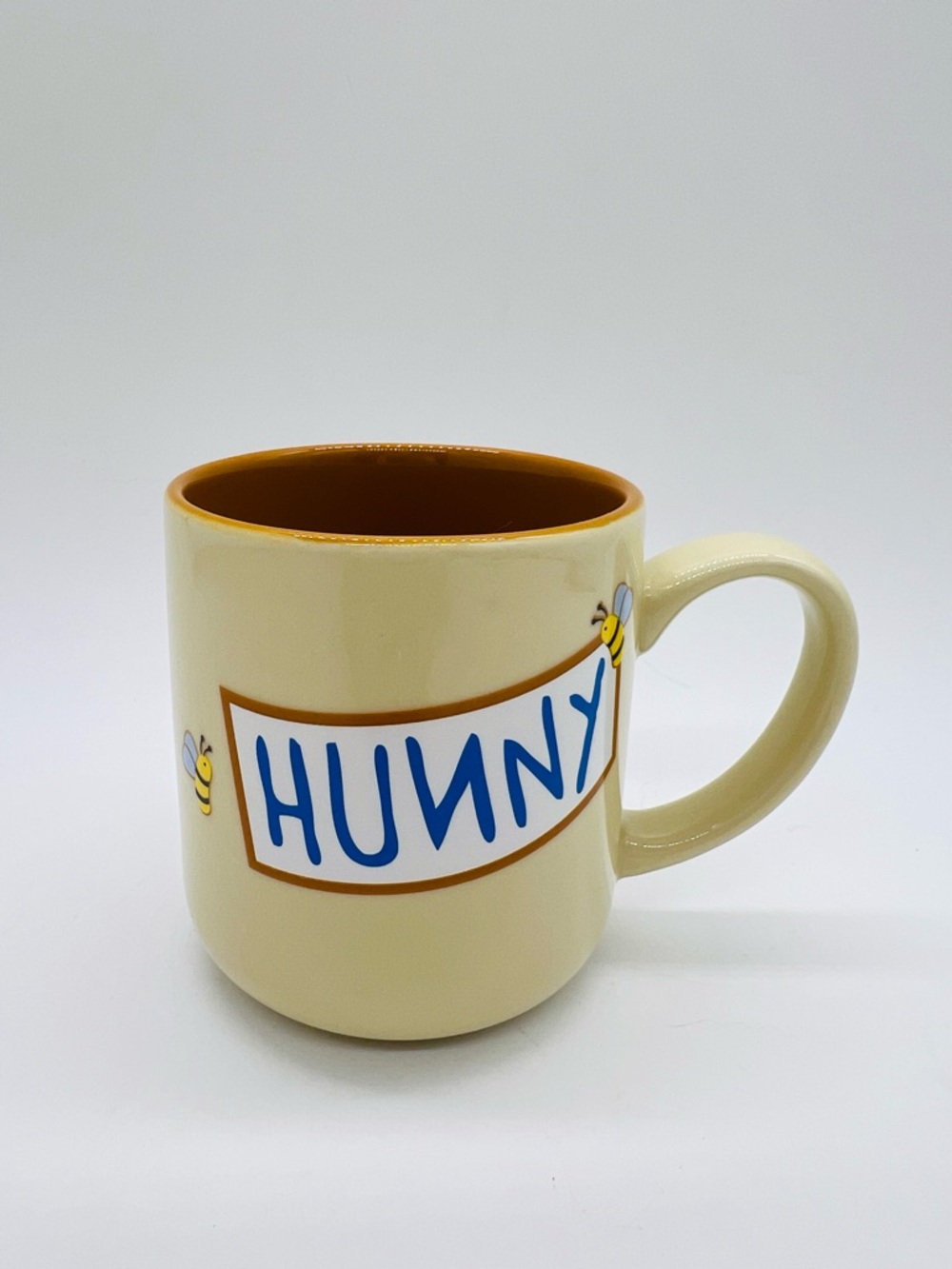 Disney Cream 'HUNNY' Mug with Brown Interior and Blue Lettering